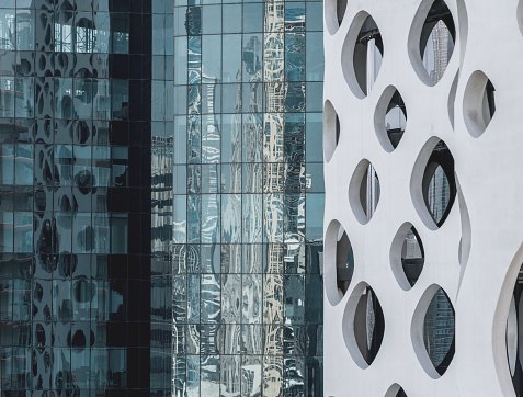 Apartment facades with varied balcony and window designs