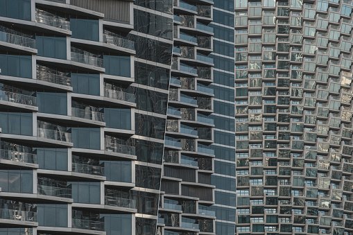 Glass facades and balconies of high-rise buildings