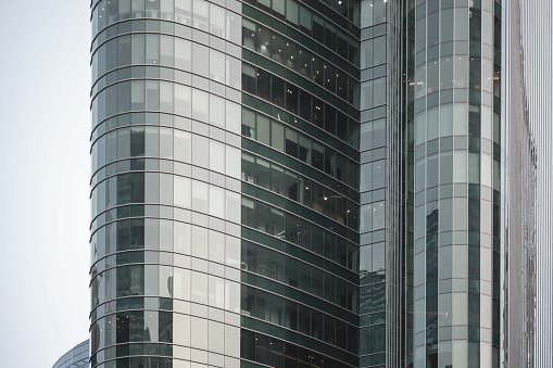 Large curved glass facade of an office building